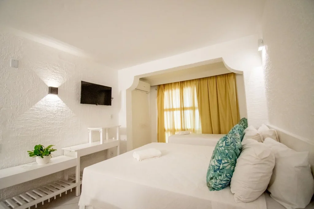 Suíte Luxo — Cama de casal e decoração do quarto